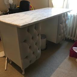 Beautiful nail table. Has marble effect fablon on the top. Has a cupboard and three drawers for storage. Has an extension lead attached to the side of the desk for plugs. Contents not included. good solid piece of furniture. Please excuse the mess in the photos, we are having a major sort out of our business room/office. Collection only.