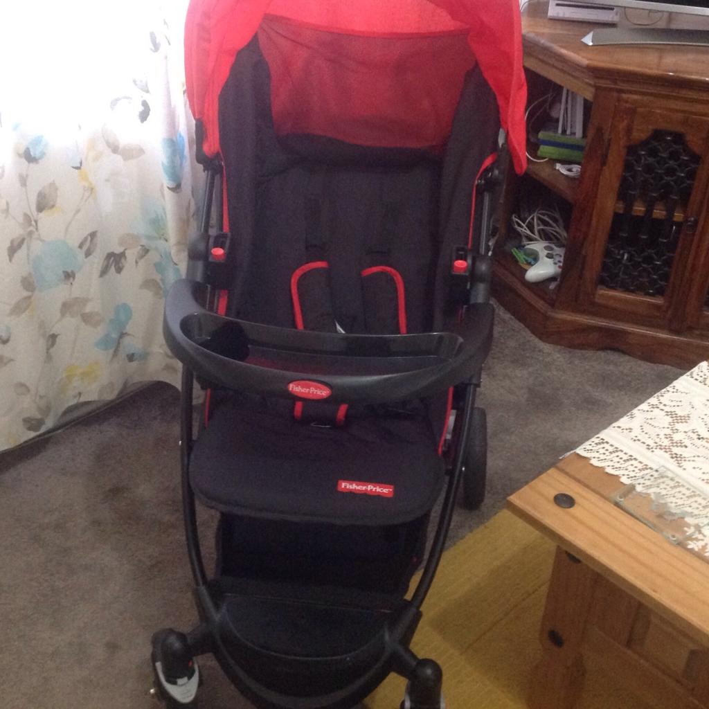 Fisher price pushchair 2024 black and red