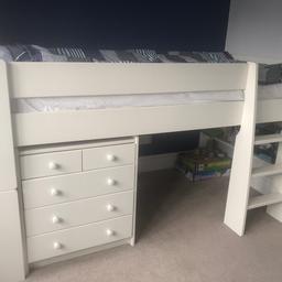 White single cabin bed with 5 drawers and under-bed shelving. My son used this from age 4 to 11. Good condition with a few wear marks. Mattress not included. 