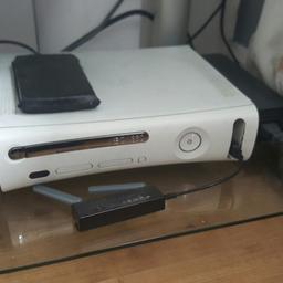 xbox 360. good condition with 120gb hard drive and 20gb external memory unit and wireless WiFi adapter with a wired controller and 22 games and a headset