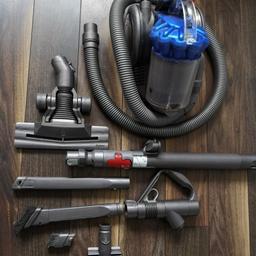 Dyson dc26 hoover. this is designed to be packed away so ideal for small houses or flats. in good working order with a selection of attachments.