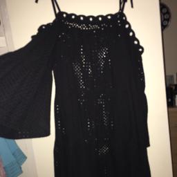 Black top that goes over swim wear on the beach size 16/18 new never been worn