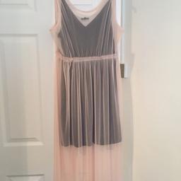 Size 14 black underneath and pale pink net on top
Collection only