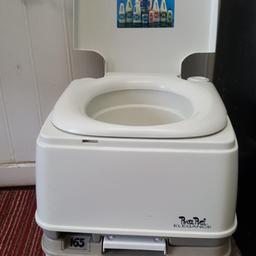 porta potti model 165 which is the largest one splits in middle for easy emptying .great for camping or anywhere you need a portable toilet .comes with chemicals .in great condition very clean like new