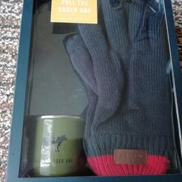 Unopened, unused Christmas present. Mug and gloves Joules make. Tag line on mug reads "pull the udder one" with a picture of a cow.