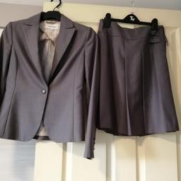 Ladies grey skirt and jacket fully lined. Suit is like new. A lovely mid grey shade. Skirt is knee length