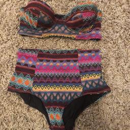 Knitted detail high waisted bikini
Too and bottoms are size 10
No straps
No zip or fastenings on the bra top
It’s a small 10 could fit a size 

Any additional postage £2.99