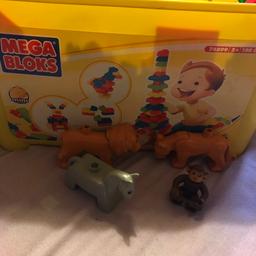 Over 200 building blocks, plus a couple of animals. Still in original box, very good condition