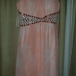 Used once 
Size 18, stretchy at the back.
Beautiful colour 
Perfect condition 
Postage can be arranged for an extra £3