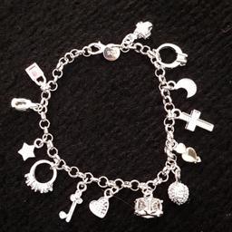 lovely silver charm bracelet stamped 925.
brand new in box never worn.