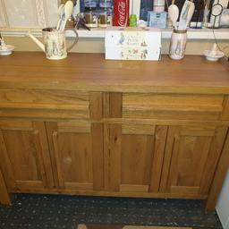 in very good condition and very heavy it has a shelf in both cupboards and 2 draws