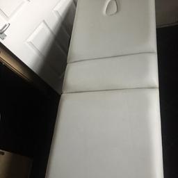 Beauty massage table with adjustable back folds away for mobile work comes with cover but has marks and broken zip. There are marks and a scuff on the side of the bed