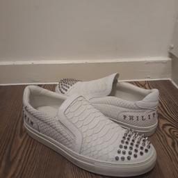 genuine philipp plein trainers. size 40.5 which is uk7 i think. in good overall condition but show signs of wear. grear bargain. these retail for a lot more. come with original dust bag and plastic bag for each trainer