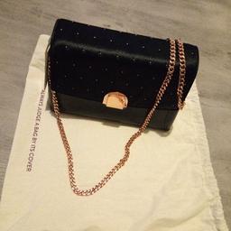 comes with canvas bag. black with Rose gold accessories.