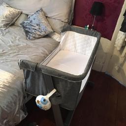 babylo cot zips down at front and sitts next to bed easy to get baby in and out also can be used as normal cot with all sides up its like new onky use a few month as babys grown out of it