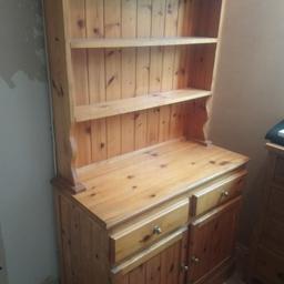 I'm selling our lovely Welsh pine dresser. Its got some lovley character about it. It does need some tlc ( a few pin holes hear and there.) but will come up amazing. It has top shelves, tongue and groove affect back, two draws and two Cubards. The over all size is 67" high. And the base high is 31" and it is 37.5" wide, with a debth of 17"5".
