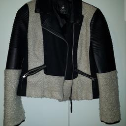 Black and beige biker style jacket. Excellent condition.  Hardly worn. Fully lined. Size 14

Buyer collects or pays postage. No time wasters please. 