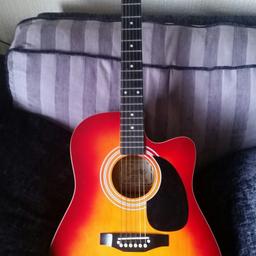 6 string electro-acoustic guitar by Encore. Attractive Red Sunburst colour. In good working condition. Can be played acoustically or amplified. Collect from Russells Hall Dudley
