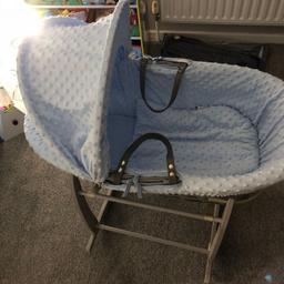 selling a clair delune blue and grey moses basket and rocking stand in excellent condition as bought 2 amd dont use this one £15 also have a bin bag of newborn and some tiny baby vests babygrows hats and outfits for £10 smoke and petfree home
