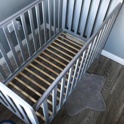 Woden gray baby cot for sale cot is in good condition has plastic strips on top