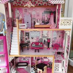 Pretty Pinks and Pastel colours perfect for the little princess in your life, little girls will adore this Kidkraft dollhouse. Includes all the furniture that you need (17 pieces) and is full of features including a lift that can take your dolls up or down a level. 

Fits full sized barbie dolls up to 30cm long. 

Full of lots of lovely detail including large windows, molded latticework, a chandelier and outdoor area upstairs. 

Made of composite wood materials, plastic, and fabric Smart, sturdy