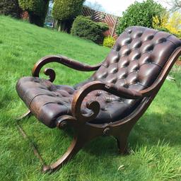 Lovely antique chair.
Leather worn with 1 tear at front and 1 at the back.
Needs a little work on the right arm.

Very unusual chair.