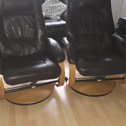 Pair of chocolate Brown leather armchairs in goods condition with headrests. 
Wooden pedestal. 
£100 for the two.