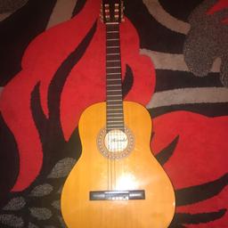 Up for grabs is a very basic, full-size, nylon-string classical guitar made in the Far East as a 'Herald' brand for JHS distributors. This guitar is good for a beginner. Got some scratches on it, but works perfectly.