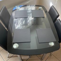 Glass 4 seater table and chairs only selling as no use or room for it 
Good condition
 £40