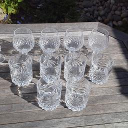 A set of 6 tumblers and 4 brandy glasses and a small vase