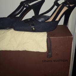 black and gold strap back genuine L.V with dust bag and box worn only a few times very nice size 39 .5