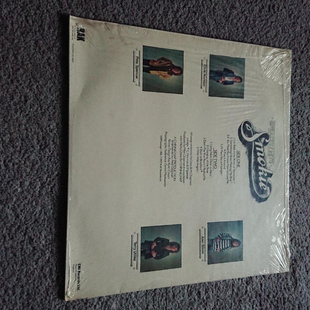 Smokie Greatest Hits vinyl,
Still has plastic cover but open from the side.