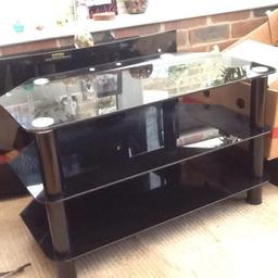 Great table in black modern glass finish and chunky legs. Great for TV, gaming , media boxes etc as has hole in back for keeping leads tidy. 2 selves and bargain to be had.