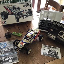 Here we have a vintage Tamiya grasshopper 2 kit number 58074 this has been in the loft for many years but well looked after before that,comes with the best acoms transmitter with its original crystals and original servos ,original manual ,and original boxes as well all in all a great little vintage kit grab a bargain .p.s I’ve given it a test run and all works well plus I’ve oiled many of the parts .