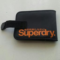 Black wallet with orange lettering and inside. Goid condition, no damage just needsd a bigger wallet
