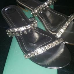 size 7
brand new
silver and crystals
cost 25 to late to return them