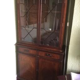 Nice Wooden display cabinet. No key. Two pieces. Signs of wear and tear as per photos. 40 cm x 186 cm (H) x 94 cm (W). Buyer collects