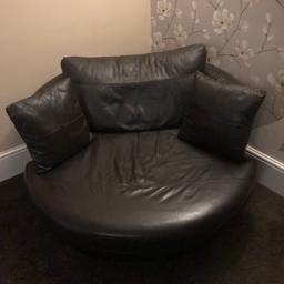 From next , is a used but in good condition is a swivel cuddle chair in brown leather, used but in good condition, any questions plze ask. No rips or tears.