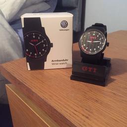 Brand new VW GTI Watch. Never been worn and still has the sticky covers on.