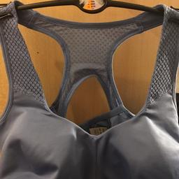 Light blue, firm fit sports bra. Size 38 DD.