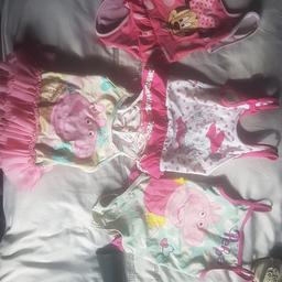 selling a bundle of 4 girls swimming costumes all will fit age 2 the pink minnie mouse age 18-24 the whote minnie mouse is 18-24 woth built in nappy the peppa pig tutu is age 2-3 but small and the green peppe is 18-24 this has some bobbling on tje crotch but all the rest great condition