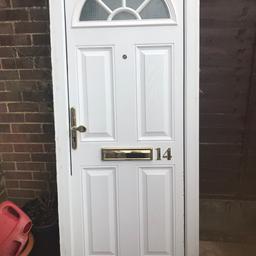 White used composite Front Door In Frame Including gold accessories. Comes with 1 x key 🔑

Has few marks hence cheap price £90 no offers

Measurements are of frame size

Width 810
Height 2000.
Half moon small top glazed window.
Opening is inwards, hinges on left hand side.