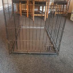 medium dog cage. good condition with removable tray. 36" length. 22" wide