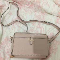 Wallet style cross body bag, hardly used and in great condition, has two compartments and a place with card slots.