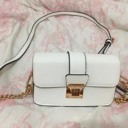 White cross body bag, hardly used and in great condition.