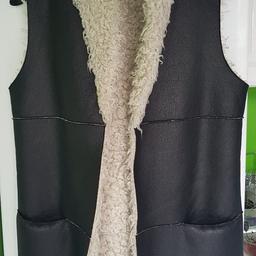Black sheepskin effect longline waistcoat with two front pockets. Medium (12-14). Excellent condition. Buyer collects or pays postage.