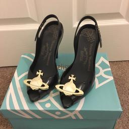 Vivienne Westwood black peep toe pointed heels with gold Vivienne Westwood orb on the front.
In really good condition only wore once for a few hours. Comes with original box and dust bag.
Size uk 5