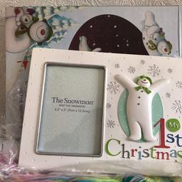 1st Christmas frame. The snowman and the snowdog frame. Never used. Comes with packaging and box