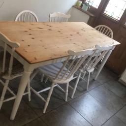 Well worn needs some attention
Fix Price Solid pine dining table with 6 chairs. Top measures 194cm L x 70cm w.

Base/legs and chairs painted white and top clear matt varnish. With a cutlery draw.

Sturdy dining table that has seen plenty of use so could do with a re-coat but is in acceptable condition with some marks and wear and tear (see photos). One chair has 1 slightly loose spindle. 