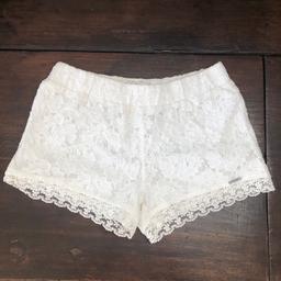 The cutest white lace shorts from Abercrombie and Fitch! Perfect for the beach to wear over a swimsuit.
Size is S (would fit size 4-6).
Good condition, worn a few times.